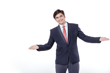 Young Indian Businessman making showing over isolated white background