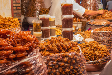 A street food stall in Morocco. Pastry and patisserie are exhibited for sale in bags. 