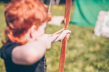 The red-haired archer targets a target with an archer