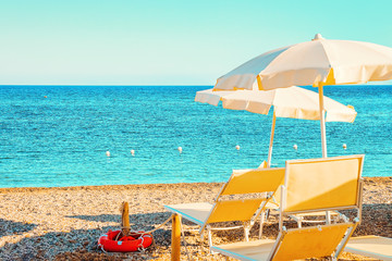 Sun umbrellas Chia Beach and Mediterranean Sea South Sardinia Italy