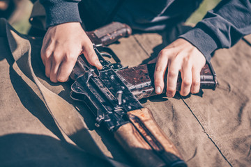 The instructor shows how to disassemble the AK-47 Kalashnikov