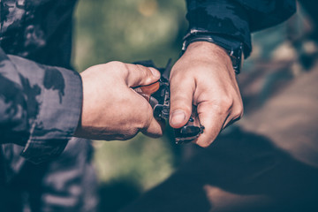 The instructor shows how to disassemble and assemble a Makarov pistol