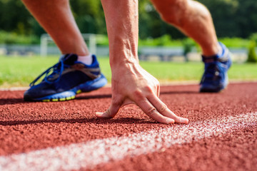 Runner ready to go close up. Ready steady go concept. At the beginning of great sport career. Hand...