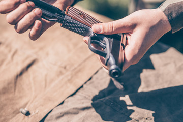 The instructor shows how to disassemble and assemble a Makarov pistol