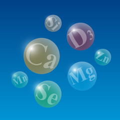 Glowing spheres with useful microelements on blue background