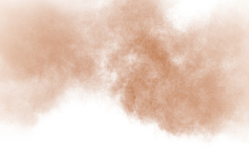 Fototapeta na wymiar Brown color powder explosion cloud isolated on white background.Brown dust splashing on background.
