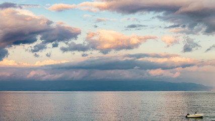 Naklejka premium Boat in Mediterranean Sea Santa Teresa di Riva Messina Silicy
