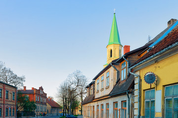 Street view with Saint Catherine Church in Kuldiga Latvia