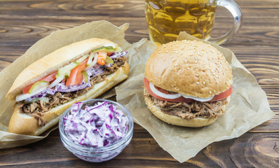 sandwich and burger with pulled pork, cole slaw and beer