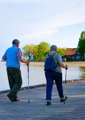 Senior people doing nordic walking at Nida Curonian Spit Lithuania