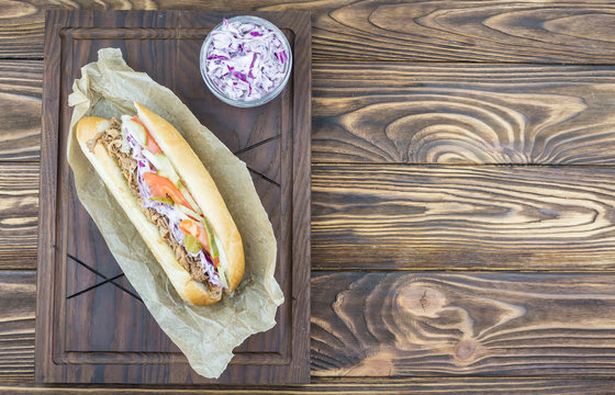 Sandwich With Pulled Pork, Cole Slaw, On A Board