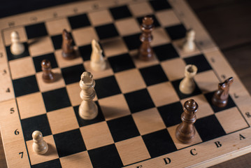 Chess on chessboard close up