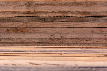 Obraz premium Wooden pine background from a close-up of wet boards, selective focus