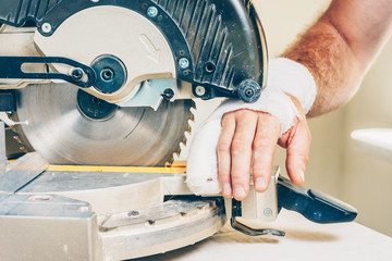 Bandaged hand injured with a circular saw