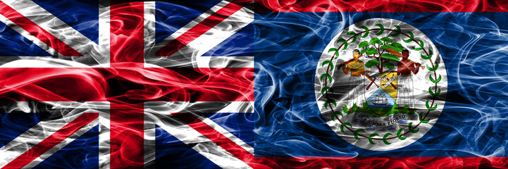 United Kingdom vs Belize smoke flags placed side by side. Thick colored silky smoke flags of Great Britain and Belize