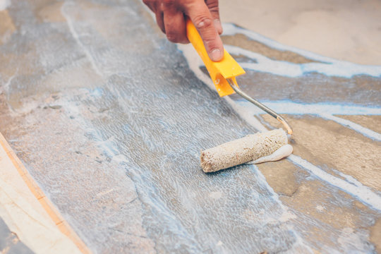 Finishing Works - A Working Roller Primer Floors For Laying Tiles