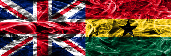 United Kingdom vs Ghana smoke flags placed side by side. Thick colored silky smoke flags of Great Britain and Ghana