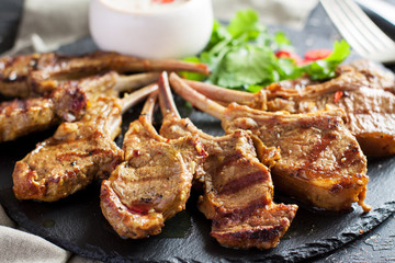 Grilled lamb ribs with spices and yoghurt sauce