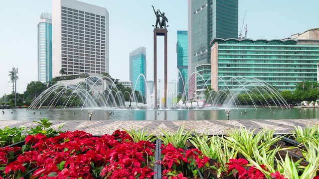 JAKARTA, Indonesia - August 24, 2018: Time lapse footage of Selamat Datang Monument or Welcome Monument with fountain in the Hotel Indonesia roundabout. Shot in 4k resolution