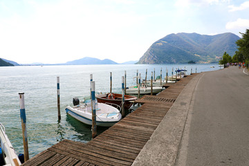Boats moored in Peschiera Maraglio with Lake Iseo on the background, Monte Isola, Italy