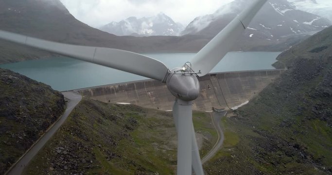 Barrage and wind turbine back fly - Aerial 4K