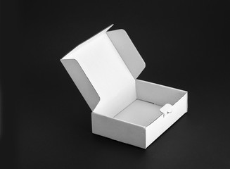 Cardboard paper box on a black background