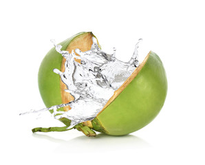 Green coconut with water splash isolated on white background.