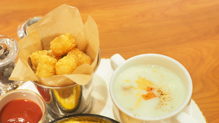 Cheesy fries and tomato sauce with mushroom soup has copy space