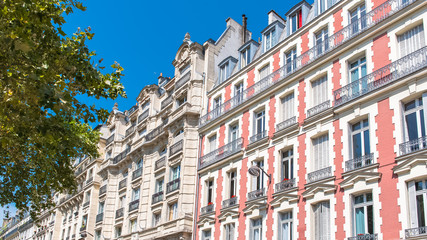 Paris, beautiful pink building boulevard Voltaire, typical parisian facade 
