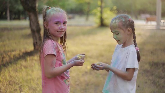 Two little girls having fun at the festival of colors Holly