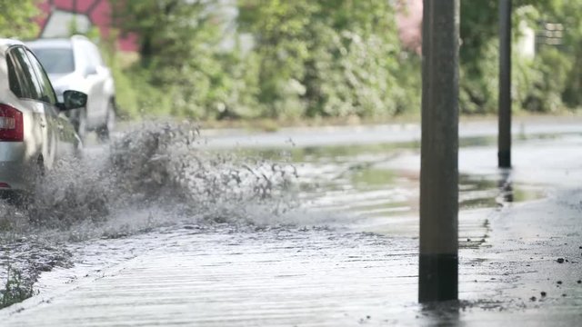 Cars driving in a flash flood 