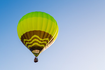 Colorful hot air balloon against the blue sky