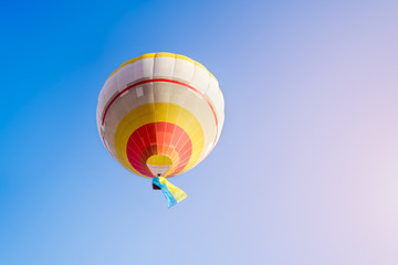 Colorful hot air balloon against the blue sky