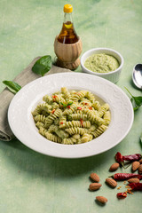 fusilli with pesto sauce and hot chili pepper
