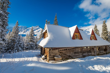 Fototapeta premium Mountain huts and sunrise in winter, Poland, Europe