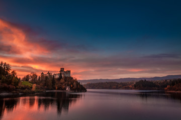 Fototapeta na wymiar Stunning dusk over castle by the lake in Niedzica
