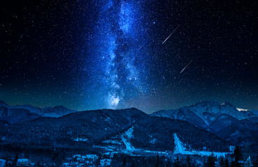 Falling stars and Giewont at night in winter, Tatra Mountains