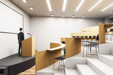 Caucasian businessman in auditorium