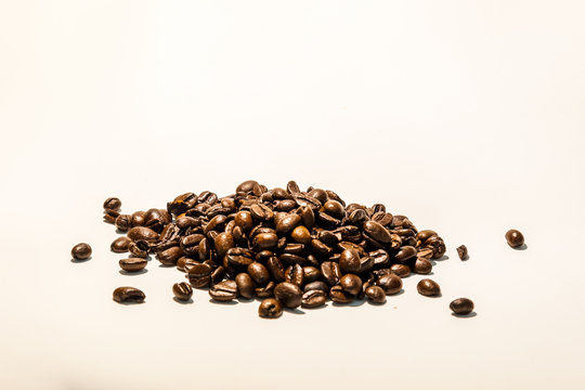 Roasted coffee beans image on white background, with space for text. Check my profile for similar images.