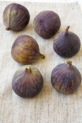 Fresh figs on cloth, side view. Closeup. Summer fruit.