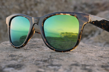  reflection of the summer sea in sunglasses