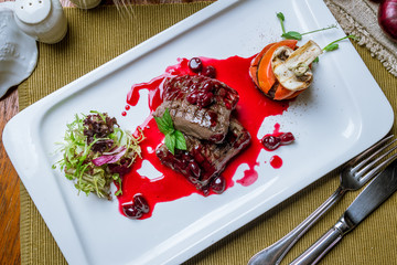 fried deer fillet with berry sauce