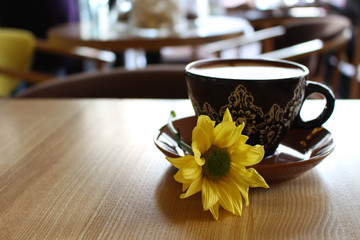 Coffee and yellow flower 