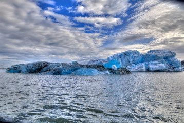 Fototapeta na wymiar Iceberg, skies, mountains, lagood and lakes