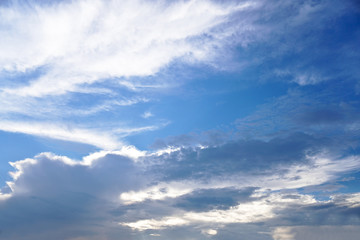 Obraz premium Beautiful white and gray clouds against the blue sky. Summer and autumn day with a view from the airplane to the atmosphere. Stock Photo for design