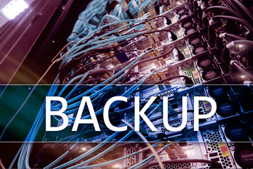 Backup button on modern server room background. Data loss prevention. System recovery.