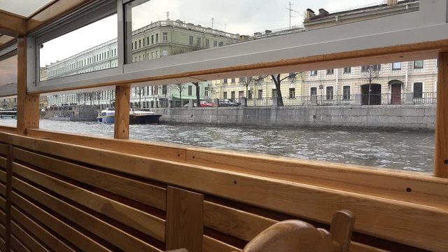 view of the embankment from the window of the passing ship.