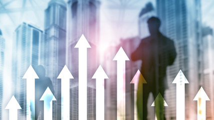 Up arrow graph on skyscraper background. Invesment and financial growth concept.