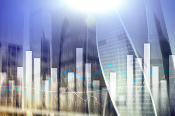 Financial graphs and charts on blurred business center background. Invesment and trading concept.