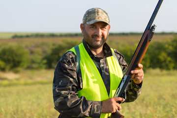 Hunter with a German trotter and spaniel, hunting a pheasant with dogs